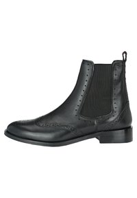 Stivali Chelsea in pelle nera con pannelli laterali elasticizzati, dettaglio brogue sulla punta e tacco basso impilato per maggiore stabilità.