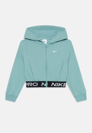 Lys teal zip-up hættetrøje med hætte, lange ærmer, lille hvid Nike-logo på brystet og sort elastisk talje med "NIKE PRO" tekst.