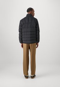 Tommy Jeans PACKABLE JACKET - Down jacket - black