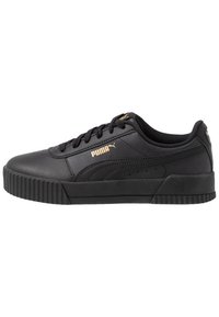 Baskets en cuir noir avec une finition texturée, présentant une semelle en caoutchouc striée et un logo Puma doré sur le côté et la languette.