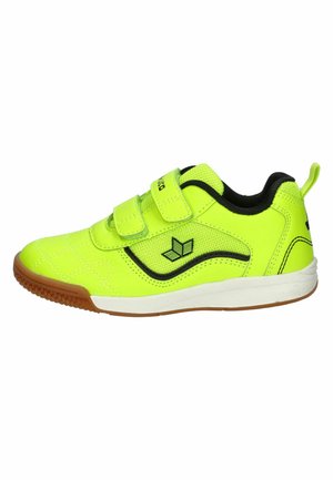 Bright yellow sports shoe with black trim, two Velcro straps, a white sole, and a brown textured outsole.