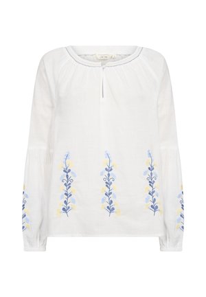 Valge pikkade varrukatega pluus, millel on sinised ja kollased lillelised tikandid esiosas, ümmargune kaelus ja väike võtmeaugu avamine.