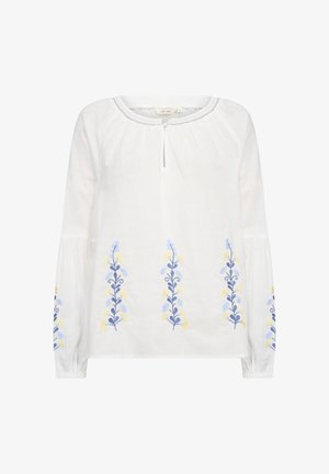 Bílá dlouhá košile s dlouhými rukávy, zdobená modrou a žlutou květinovou výšivkou na přední straně, s kulatým výstřihem a malým otvorem ve tvaru klíče.