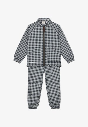 Conjunto infantil de chaqueta acolchada y pantalones con estampado de cuadros en azul marino y blanco, con cremallera frontal y puños elásticos.