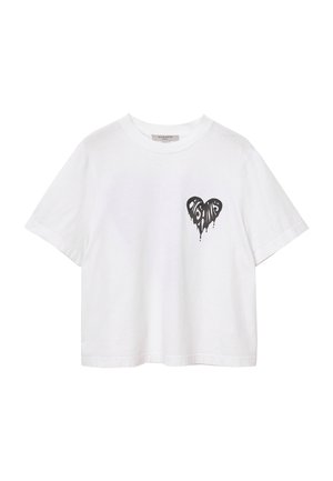 T-shirt bianco in cotone dalla vestibilità rilassata, con una grafica di un cuore nero colante sull'area sinistra del petto. Maniche corte e collo tondeggiante.