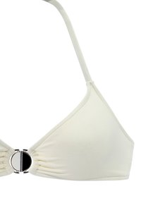 Triangle bikini top in soft cream fabric with a ruched design. Features a silver circular hardware accent at the center. Adjustable straps.