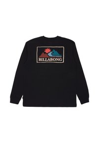 Maglietta nera a maniche lunghe con una grafica colorata di montagne e onde, con il testo "BILLABONG" in crema. Materiale in cotone morbido.
