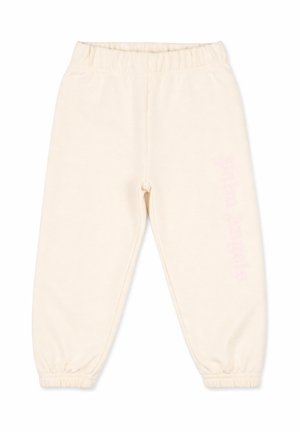 Pantaloni jogger in pile color crema con vita e polsini elastici, disposti in posizione distesa su sfondo bianco.
