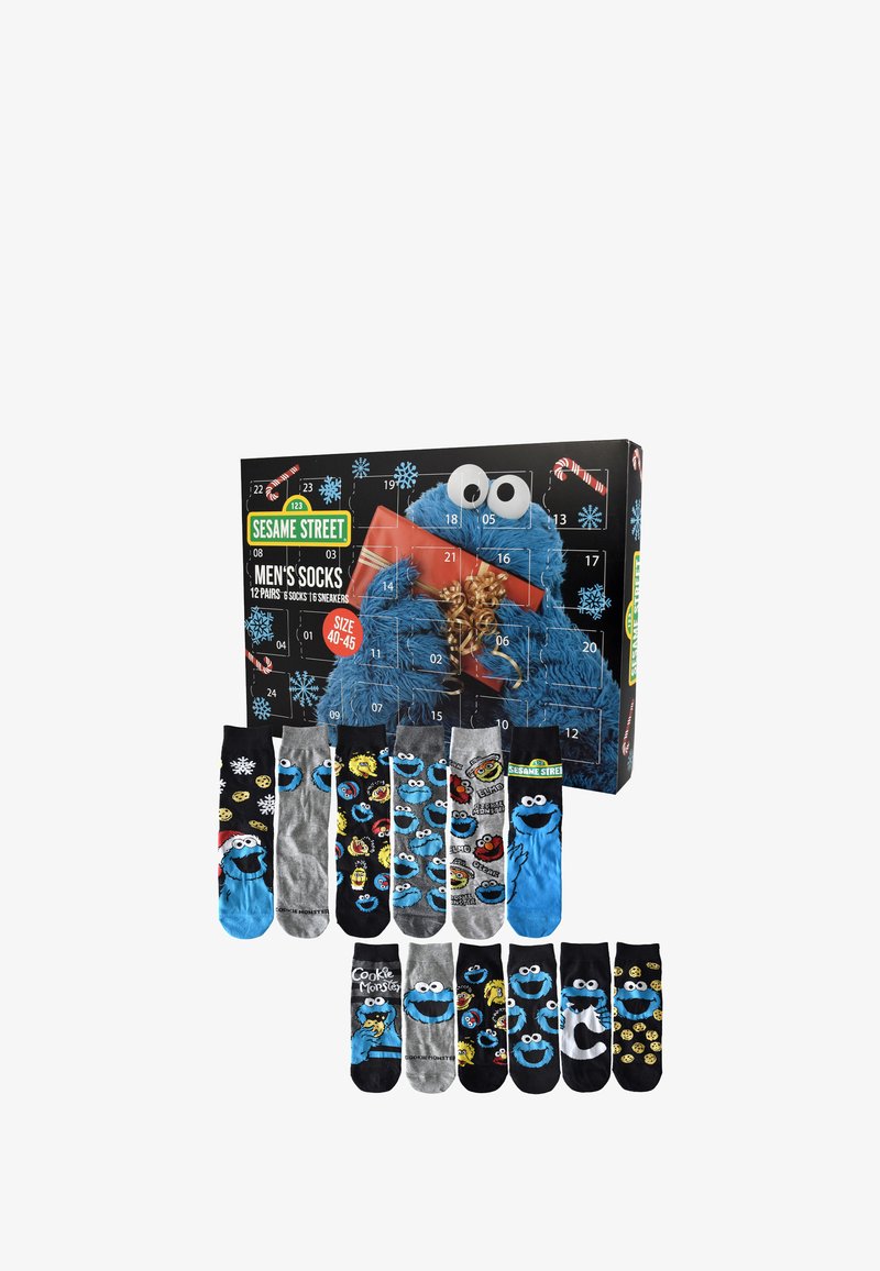Set di 12 calzini da uomo a tema cartone animato caratterizzati da vari design, principalmente in blu, nero e grigio, con il Cookie Monster e motivi festivi.