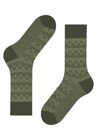 Grüne gemusterte Socken mit einem geometrischen Dreiecksdesign und strukturierten Akzenten an der Ferse und der Spitze. Gerippter Schaft.