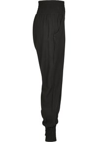 Pantalon noir effilé avec taille élastique froncée et bas de jambes à revers, doté de poches latérales et d'une coupe décontractée.