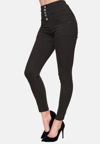 Jeans skinny neri a vita alta con chiusura a cinque bottoni, tasche frontali e tessuto elasticizzato per una silhouette aderente.