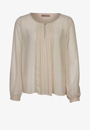 Kremowa bluzka z długim rękawem, okrągłym dekoltem, pionowymi zakładkami z przodu oraz mankietami na guziki.