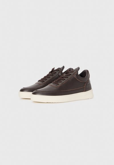 Pair of dark brown leather sneakers with textured surface, lace-up design, and thick white rubber soles on a white background.