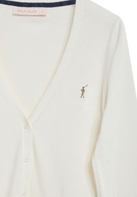 Vit cardigan med v-ringning, med en subtil stickad textur och en liten brun broderad figur på vänster bröst. Runda knappar.