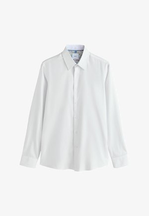 Hvid langærmet skjorte med spids krave, knaplukning foran og blomsterprint indvendig krave. Glat stoftekstur.