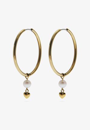 Gold hoop earrings feature a white pearl and small gold heart charm dangling from each hoop. Smooth metal with a polished finish.