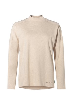 Beige long-sleeve top with a mock neck, made from soft fabric. Features dropped shoulders and a rounded hem. Logo printed on the lower left side.