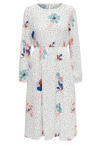 Valkoinen pitkähihainen midi-mekko, jossa on mustia pilkkuja, vyötäröstä kireä, ja suuria vaaleanpastellisia kukkakuoseja sinisen, pinkin ja violetin sävyissä.