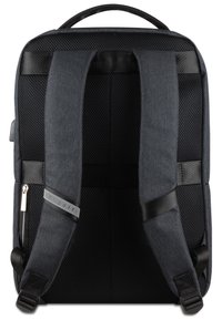 Black fabric backpack with mesh back panel, padded shoulder straps, and silver hardware detail. Accents include a logo tag on one strap.