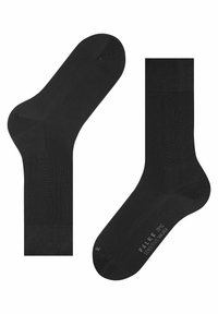 Czarne skarpetki do kostek o gładkiej fakturze, zaokrąglonym palcu i oddychającym ściągaczu z siateczki. Na podeszwie znajduje się tekst z brandingiem.