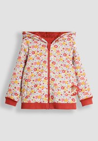 Felpa con zip floreale su fondo bianco, caratterizzata da vivaci motivi di fiori rossi e gialli. Polsini e orlo rossi con un dettaglio di design giocoso.