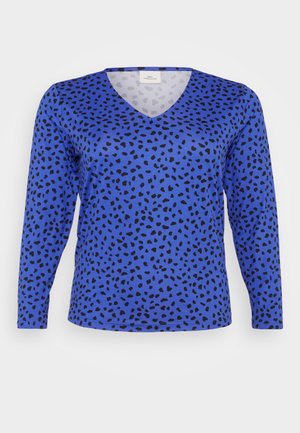 T-shirt à manches longues bleu en V avec un motif de taches de léopard noires. Texture lisse, coupe classique et ourlet standard.