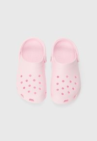 Pink clogs made of lightweight material with ventilation holes, a rounded toe, and a back strap for secure fit.
