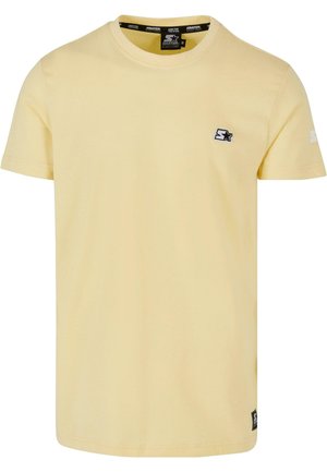 Gelbes T-Shirt mit kurzen Ärmeln aus Baumwolle. Verfügt über ein kleines schwarzes Logo auf der Brust und ein Marken-Detail am Ärmel. Rundhalsausschnitt-Design.