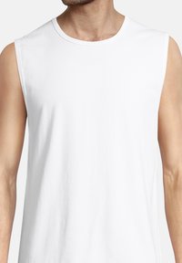 White sleeveless cotton t-shirt with a round neckline, smooth texture, and regular fit, displaying the upper torso and arms.