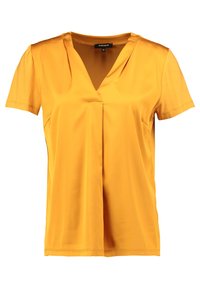 Žlutý krátký rukáv top vyrobený z hladkého materiálu, s výstřihem do V a volným střihem. Jednoduchý design bez viditelných vzorů nebo akcentů.