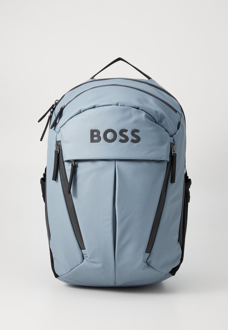 Light blue backpack with black accents, featuring a large front pocket, logo, two zippers, and padded shoulder straps for comfort.