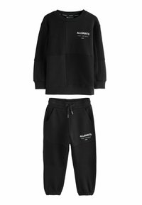 Svart sweatshirt och joggingset med AllSaints-logotyp och japanska tecken på bröstet och låret, med dragsko i midjan och elastiska manschetter.