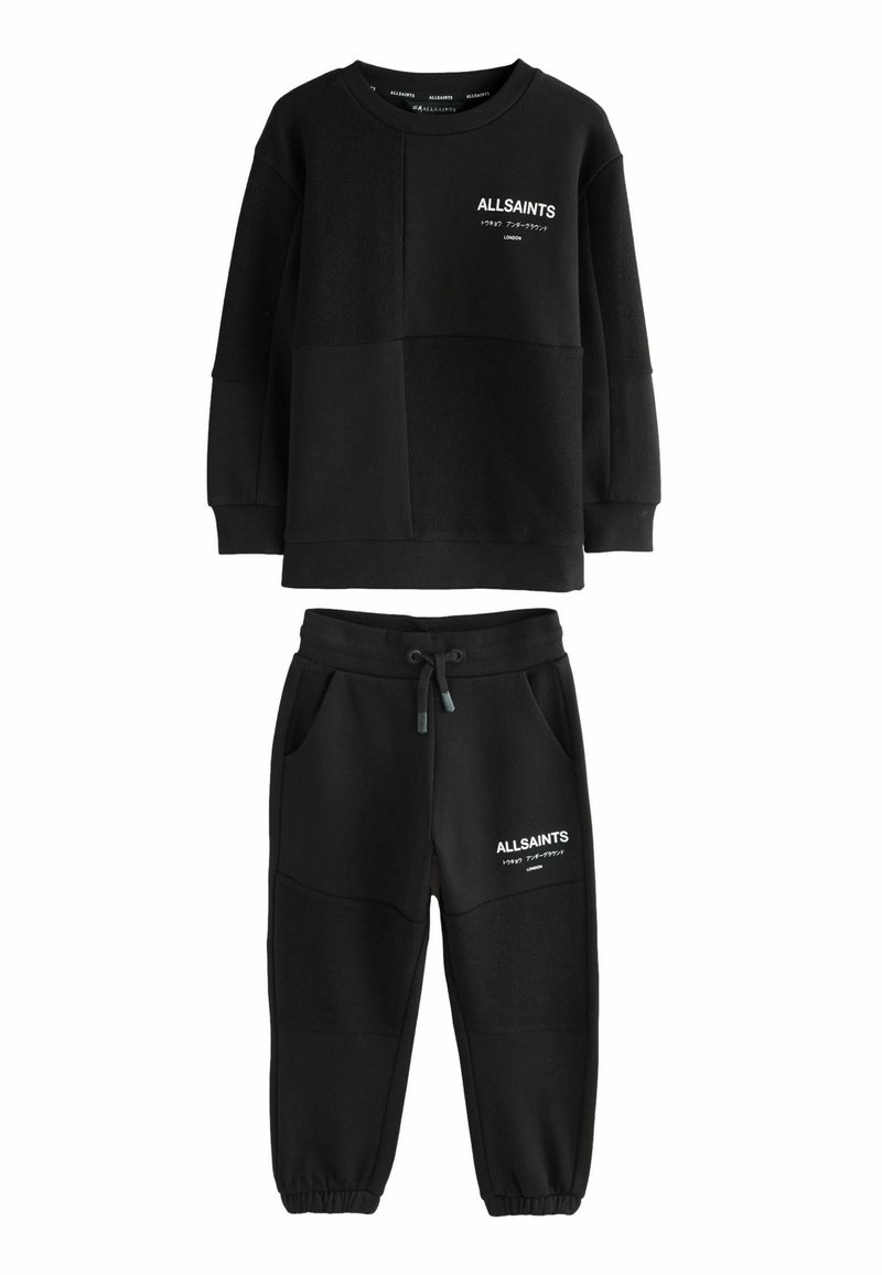 Svart sweatshirt och joggingset med AllSaints-logotyp och japanska tecken på bröstet och låret, med dragsko i midjan och elastiska manschetter.