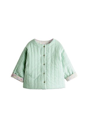 Roheline ja valge gingham-mustriga nööbitav jakk, millel on rullitud lillemustrilised varrukaääred ja ümmargune kaelus, valgel taustal.