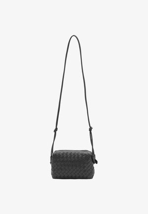 Black woven leather crossbody bag with an adjustable strap, rectangular shape, and textured pattern. Closure details not visible.
