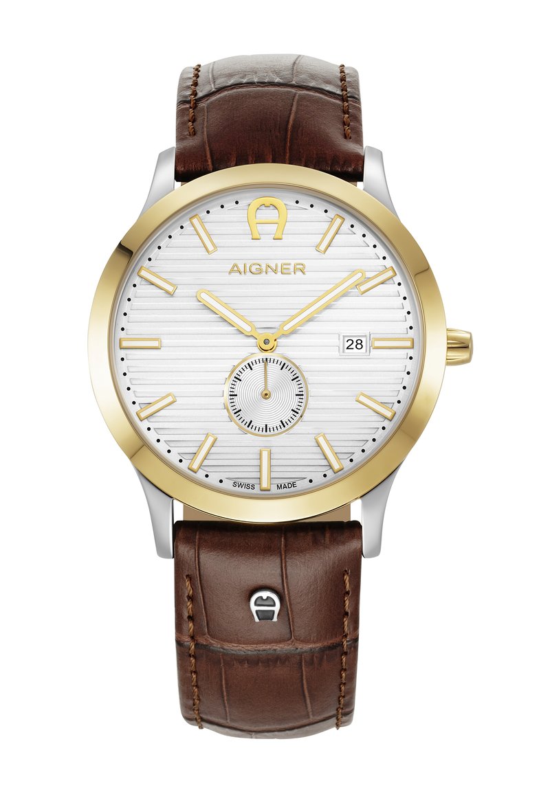 Orologio Aigner con quadrante bianco testurizzato, dettagli in tonalità oro, cassa argentata e cinturino in pelle marrone con motivo a coccodrillo. Funzione di display della data.