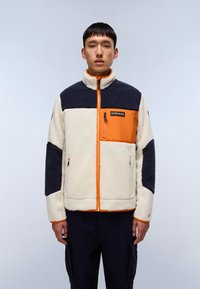 Fleece jacket featuring cream, navy, and orange panels, high collar, front zip, chest pocket, and adjustable waist. Textured fabric.