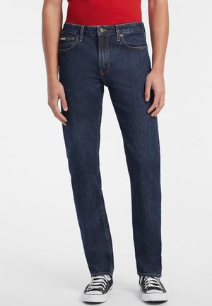 Dark blue denim straight-leg jeans with front pockets and a classic five-pocket design, featuring orange stitching and a metal button.