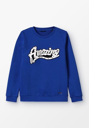 Sweat-shirt bleu à manches longues avec poignets et ourlet côtelés, orné sur le devant d'une application "Amazing" en blanc et noir avec de petites clous.