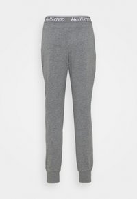 Grå sweatpants med mjuk textur, elastisk midjeband med en logotyp och smalnande ärmar vid anklarna för en åtsittande look.