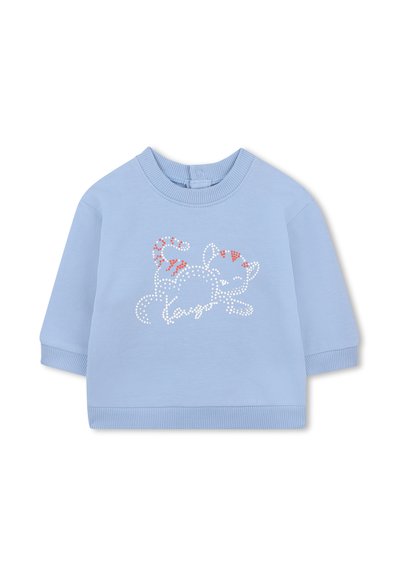 Jasnoniebieska bluza z okrągłym dekoltem i długimi rękawami, zdobiona wzorem kota z dżetami i ściągaczem u dołu.