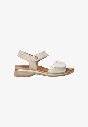 Sandale beige à bout ouvert avec brides réglables en Velcro, petit talon compensé et semelle intérieure rembourrée pour plus de confort et de soutien.