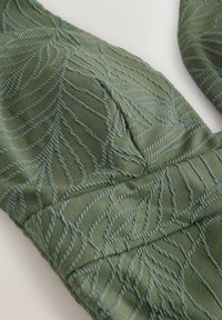 Unselected, khaki green leaf textured