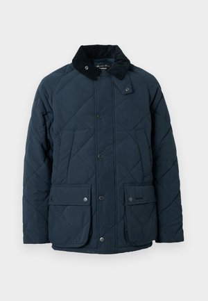 Casaco acolchoado azul-marinho com colarinho de bombazina, dois bolsos frontais com aba e botões de pressão, apresentando uma superfície texturizada e um design clássico.