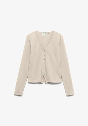 Cardigan bej cu mâneci lungi și decolteu în V, cu șase nasturi în față și o margine ușor croită, prezentat întins pe un fundal alb.
