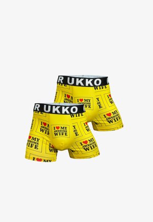 Boxers pour hommes en jaune vif, avec un texte noir répété dans des encadrés indiquant « JE T'AIME MON ÉPOUSE GÉNIALE ». Ceinture élastique avec logo.