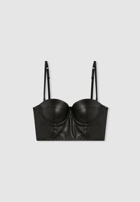Reggiseno in pelle nera con coppe strutturate, spalline regolabili e design corto. Texture liscia con dettagli delle cuciture.