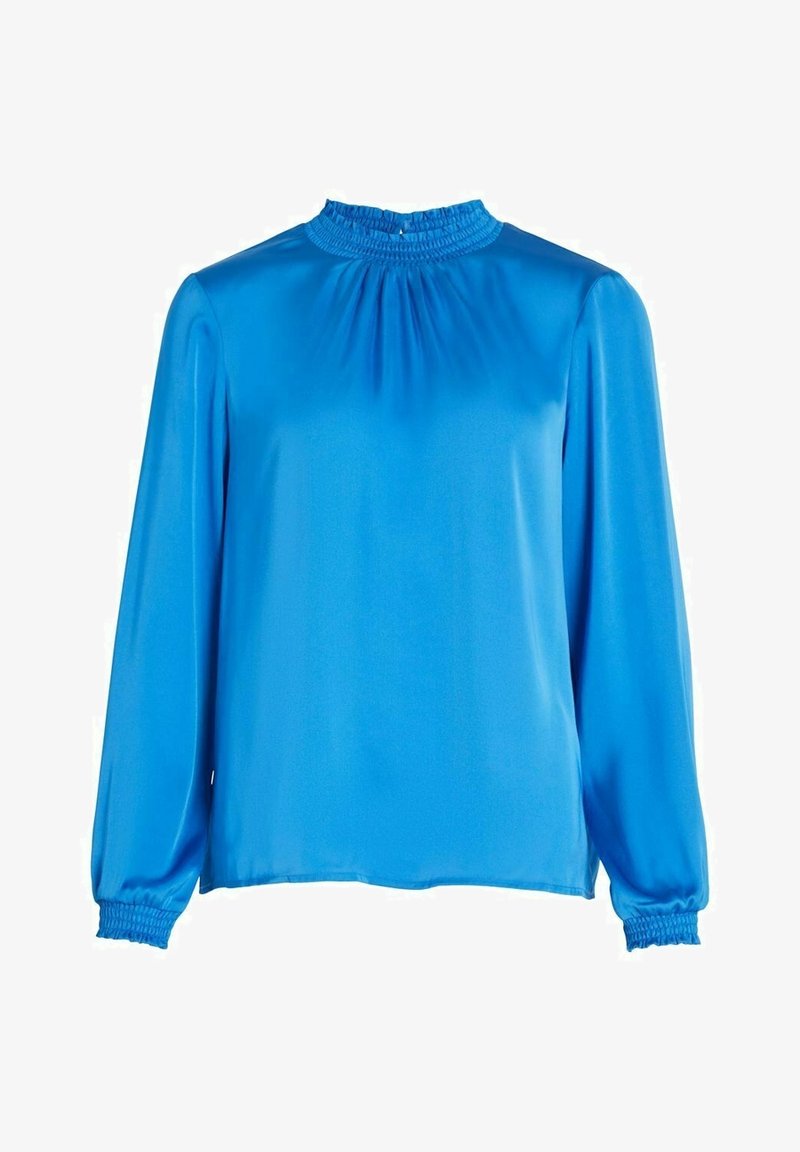 Blouse bleu vif à manches longues avec col haut froncé et poignets élastiques, tissu lisse type satin, coupe ample.