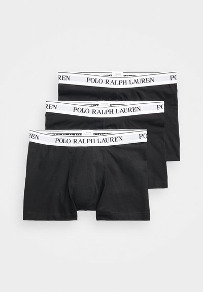 Boxer ajustados negros de algodón, con una cinturilla elástica blanca que lleva impreso "POLO RALPH LAUREN" en negro. Paquete de tres.